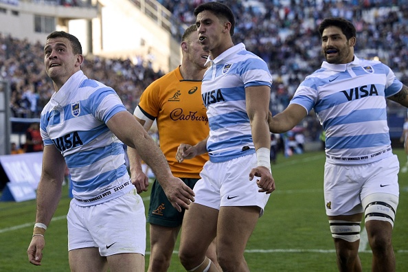 Argentina's Los Pumas wing Emiliano Boffelli (L) reacts after scoring a try against Australia's Wallabies during their Rugby Championship match at Bicentenario stadium in San Juan, Argentina on August 13, 2022. (Photo by JUAN MABROMATA / AFP)