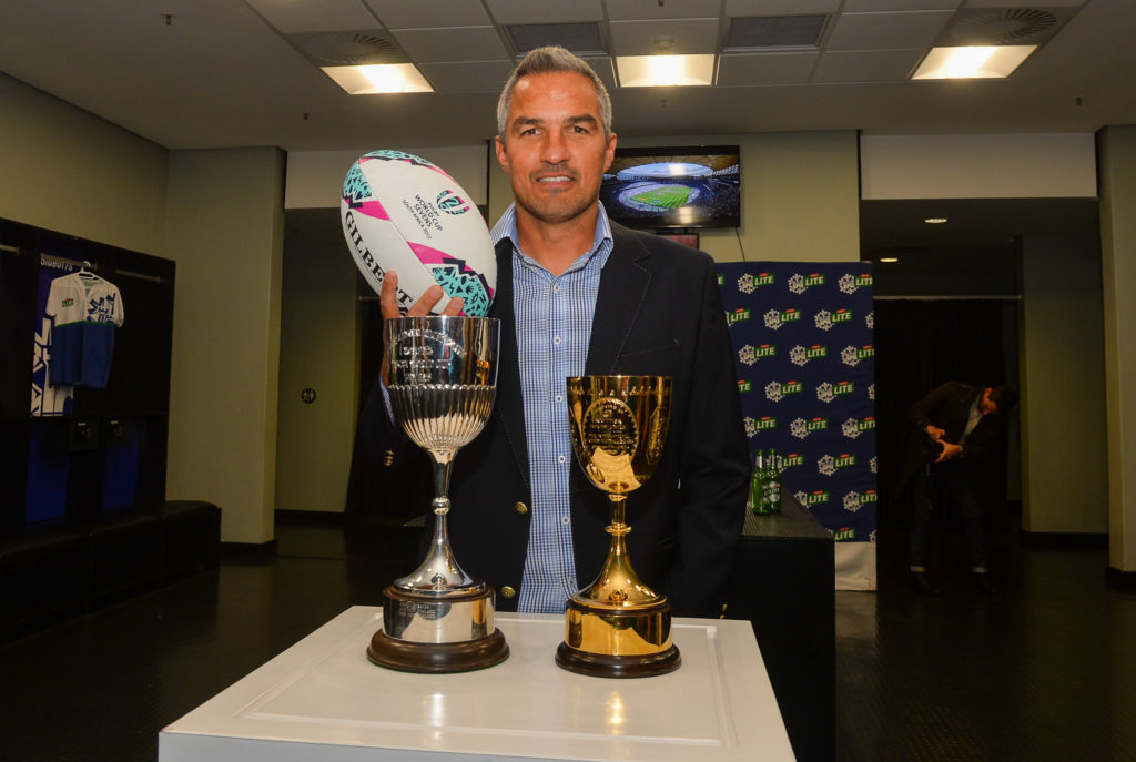 CAPE TOWN, SOUTH AFRICA - AUGUST 10: Neil Powell (Blitzboks Coach) with the trophies during the Rugby World Cup Sevens Castle Lite locker room launch at DHL Stadium on August 10, 2022 in Cape Town, South Africa.