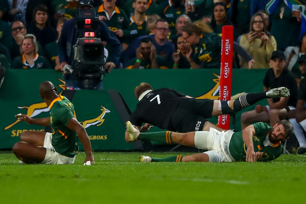 JOHANNESBURG, SOUTH AFRICA - AUGUST 13: Sam Cane (c) of the All Blacks scores in the corner during The Rugby Championship match between South Africa and New Zealand at Emirates Airline Park on August 13, 2022 in Johannesburg, South Africa.
