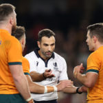MELBOURNE, AUSTRALIA - SEPTEMBER 15: Referee Mathieu Raynal speaks to Nic White and Bernard Foley of the Wallabies during The Rugby Championship & Bledisloe Cup match between the Australia Wallabies and the New Zealand All Blacks at Marvel Stadium on September 15, 2022 in Melbourne, Australia.
