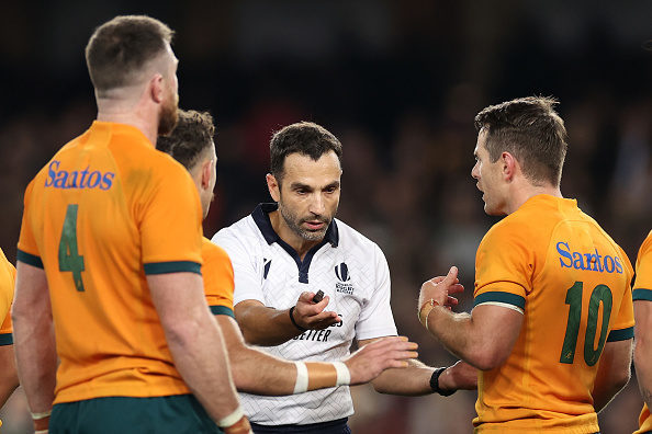 MELBOURNE, AUSTRALIA - SEPTEMBER 15: Referee Mathieu Raynal speaks to Nic White and Bernard Foley of the Wallabies during The Rugby Championship & Bledisloe Cup match between the Australia Wallabies and the New Zealand All Blacks at Marvel Stadium on September 15, 2022 in Melbourne, Australia.