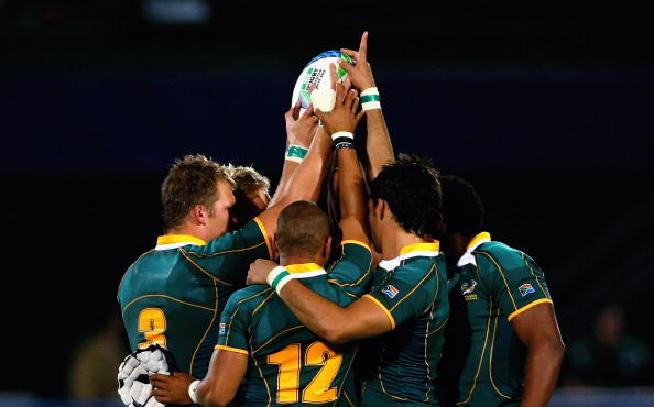 DUBAI, UNITED ARAB EMIRATES - MARCH 05: The South Africa team huddle prior to their pool C match against Japan during the IRB Rugby World Cup Sevens 2009 at The Sevens stadium on March 5, 2009 in Dubai, UAE.