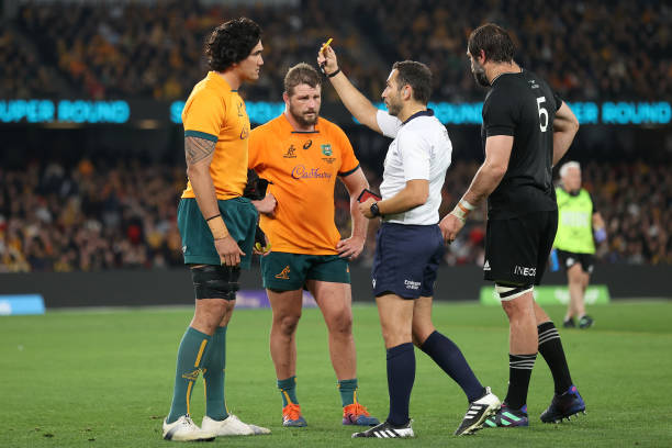 MELBOURNE, AUSTRALIA - SEPTEMBER 15: Darcy Swain of the Wallabies receives a yellow card from referee Mathieu Raynal during The Rugby Championship & Bledisloe Cup match between the Australia Wallabies and the New Zealand All Blacks at Marvel Stadium on September 15, 2022 in Melbourne, Australia.