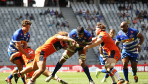 Stormers captain Marvin Orie is tackled by Pierre Schoeman of Edinburgh and Hamish Watson of Edinburgh during the United Rugby Championship 2022/23 match between Stormers and Edinburgh held at Cape Town Stadium in Cape Town, South Africa on 1 October 2022