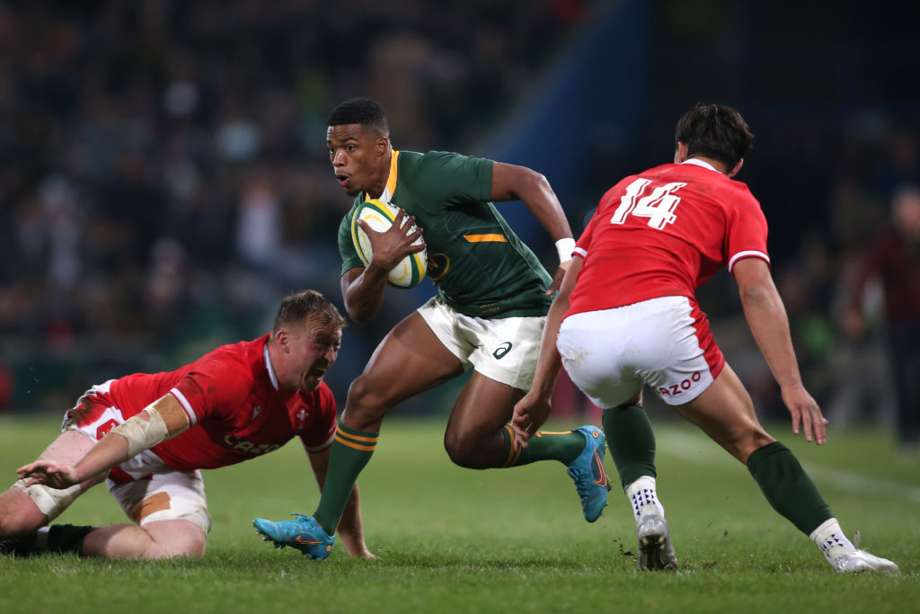 Grant Williams of South Africa attempts to get ast Louis Rees-Zammit of Wales during the 2022 Castle Lager Incoming Series match between South Africa and Wales held at Toyota Stadium in Bloemfontein, South Africa on 09 July 2022