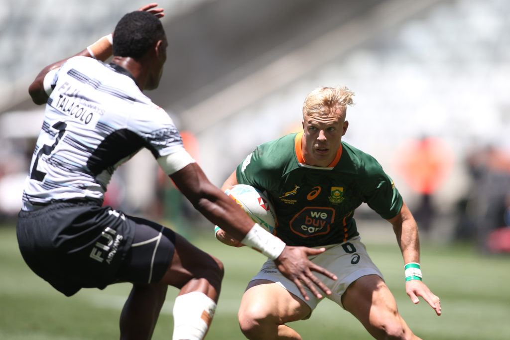 JC Pretorius of South Africa attempts to get past Joseva Talacolo of Fiji during Day 2 of the 2022 HSBC Cape Town Sevens held at Cape Town Stadium in Cape Town on 10 November 2022