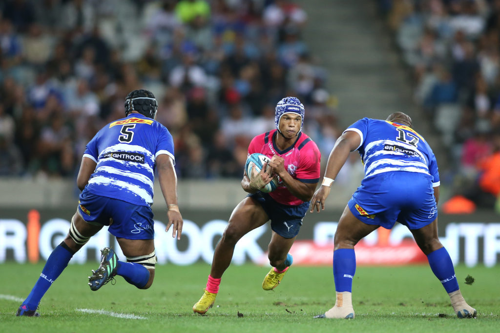 Kurt-Lee Arendse of the Bulls attempts to get past Marvin Orie of Stormers and Ali Vermaak of Stormers during the United Rugby Championship 2022/23 match between Stormers and Bulls held at Cape Town Stadium in Cape Town, South Africa on 23 December 2022