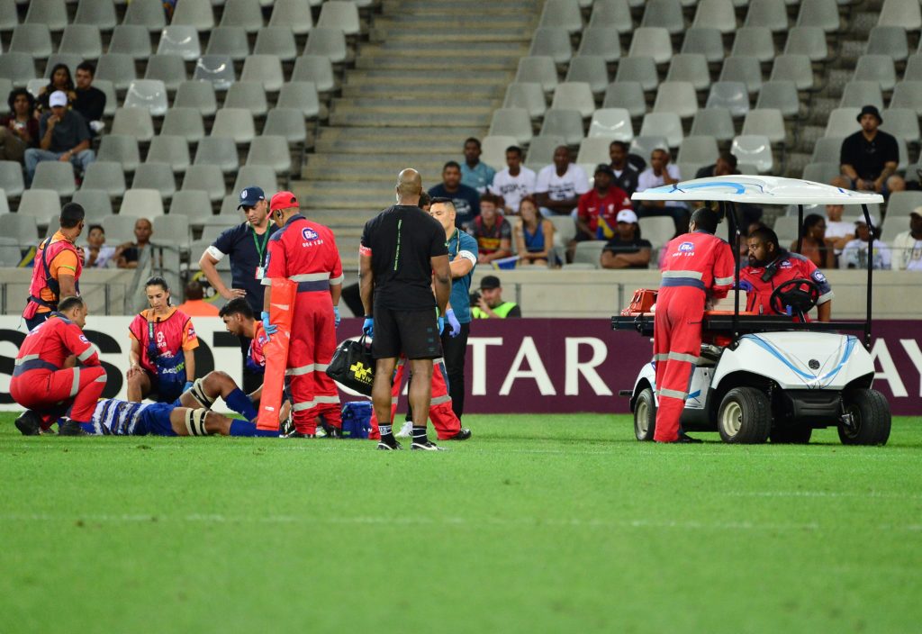 CAPE TOWN, SOUTH AFRICA - DECEMBER 17: Salmaan Moerat of DHL Stormers receives medical attention during the Heineken Champions Cup match between DHL Stormers and London Irish at DHL Cape Town Stadium on December 17, 2022 in Cape Town, South Africa.