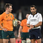 epa10185598 Australia's Bernard Foley (L) with referee Mathieu Raynal in the closing stages of the Rugby Championship match between Australia and New Zealand at Marvel Stadium in Melbourne, Victoria, Australia, 15 September 2022.