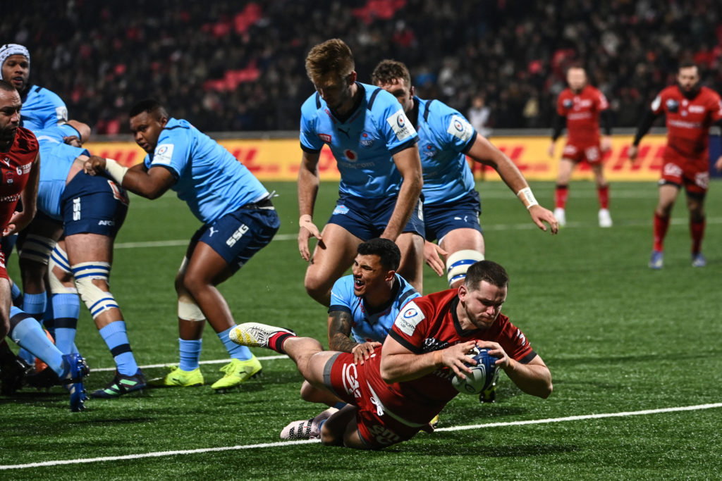 Lyons French hooker Guillaume Marchand scores a try during the European Rugby Champions Cup pool A rugby union match between Lyon Olympique Universitaire (LOU) and the Bulls at the Gerland Stadium in Lyon on January 20, 2023. (Photo by OLIVIER CHASSIGNOLE / AFP)
