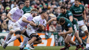 LEICESTER, ENGLAND - JANUARY 28: Leicester Tigers Will Hurd challenging Northampton Saints Juarno Augustus during the Gallagher Premiership Rugby match between Leicester Tigers and Northampton Saints at Mattioli Woods Welford Road Stadium on January 28, 2023 in Leicester, England.