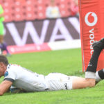 JOHANNESBURG, SOUTH AFRICA - FEBRUARY 18: Curwin Bosch of the Sharks breaks away from the Lions defence, score a try and celebrate with teammates during the United Rugby Championship match between Emirates Lions and Cell C Sharks at Emirates Airline Park on February 18, 2023 in Johannesburg, South Africa.