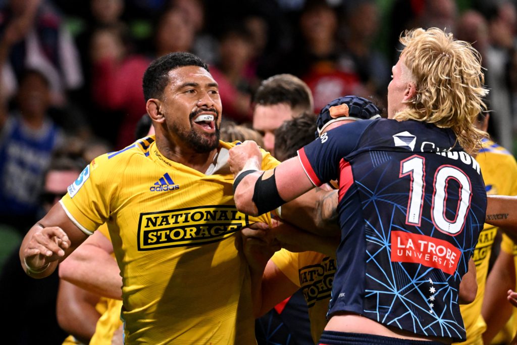 Hurricanes captain Ardie Savea (L) fights with Rebels' Aidan Morgan during the Super Rugby match between the Melbourne Rebels and Wellington Hurricanes at the AAMI Park in Melbourne on March 3, 2023. (Photo by William WEST / AFP) / --IMAGE RESTRICTED TO EDITORIAL USE - STRICTLY NO COMMERCIAL USE--