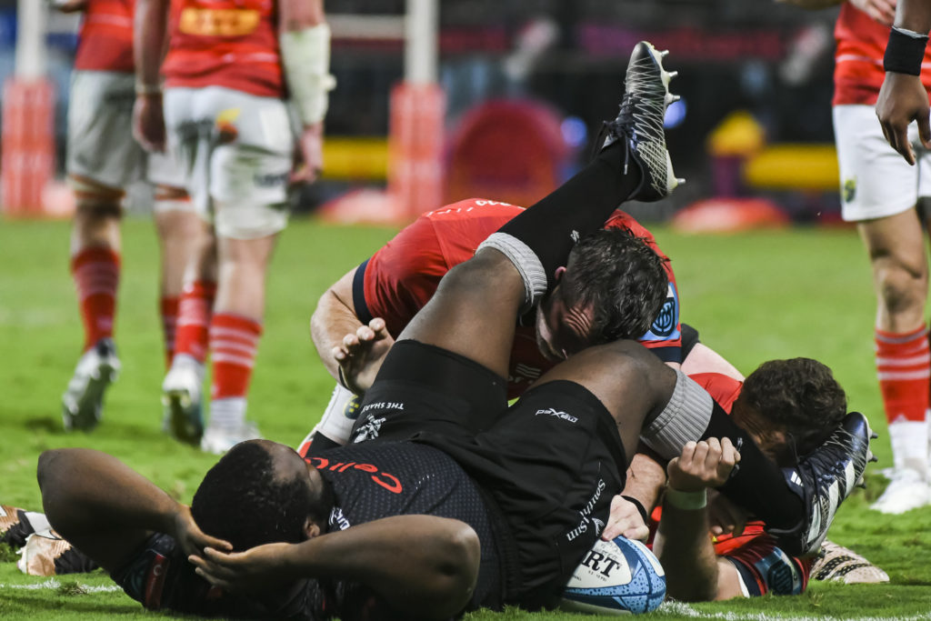 DURBAN, SOUTH AFRICA - APRIL 22: Ox Nche of the Cell C Sharks lies on Peter O’Mahony, captain of Munster during the United Rugby Championship match between Cell C Sharks and Munster at Hollywoodbets Kings Park on April 22, 2023 in Durban, South Africa.