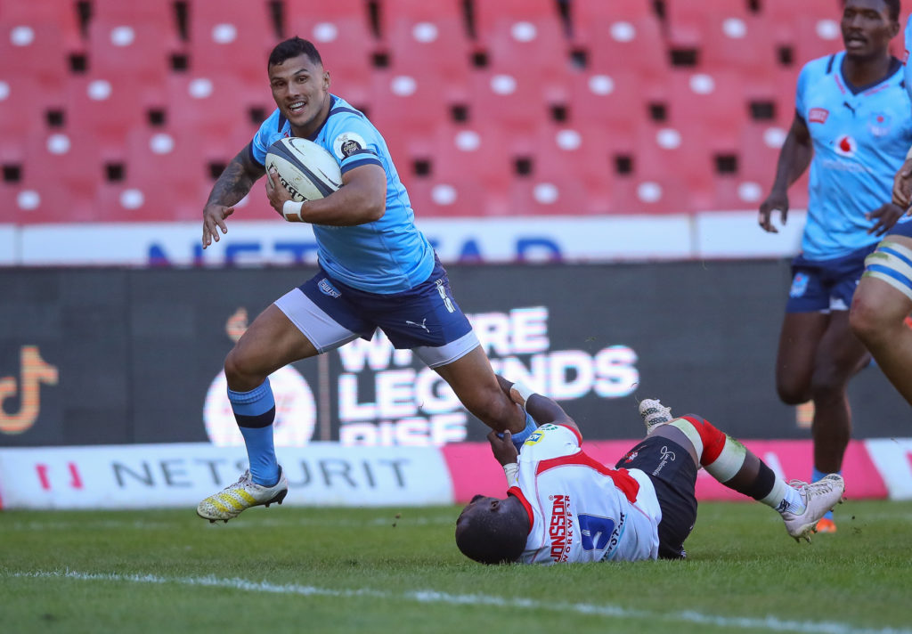 JOHANNESBURG, SOUTH AFRICA - MAY 20: Embrose Papier of the Vodacom Blue Bulls runs through the tackle of Sanele Nohamba of the Fidelity ADT Lions during the Currie Cup, Premier Division match between Fidelity ADT Lions and Vodacom Bulls at Emirates Airline Park on May 20, 2023 in Johannesburg, South Africa. (Photo by Gordon Arons/Gallo Images)
