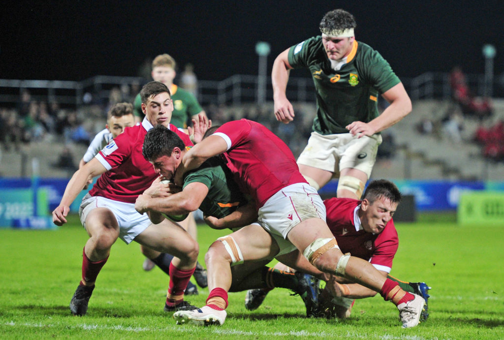 Paul De Villiers (C) of South Africa U20 is tackled by Rati Zazadze of Georgia U20 during the 2023 World Rugby U20 Championship game between South Africa and Georgia at Danie CravenStadium in Stellenbosch, South Africa on 24 June 2023