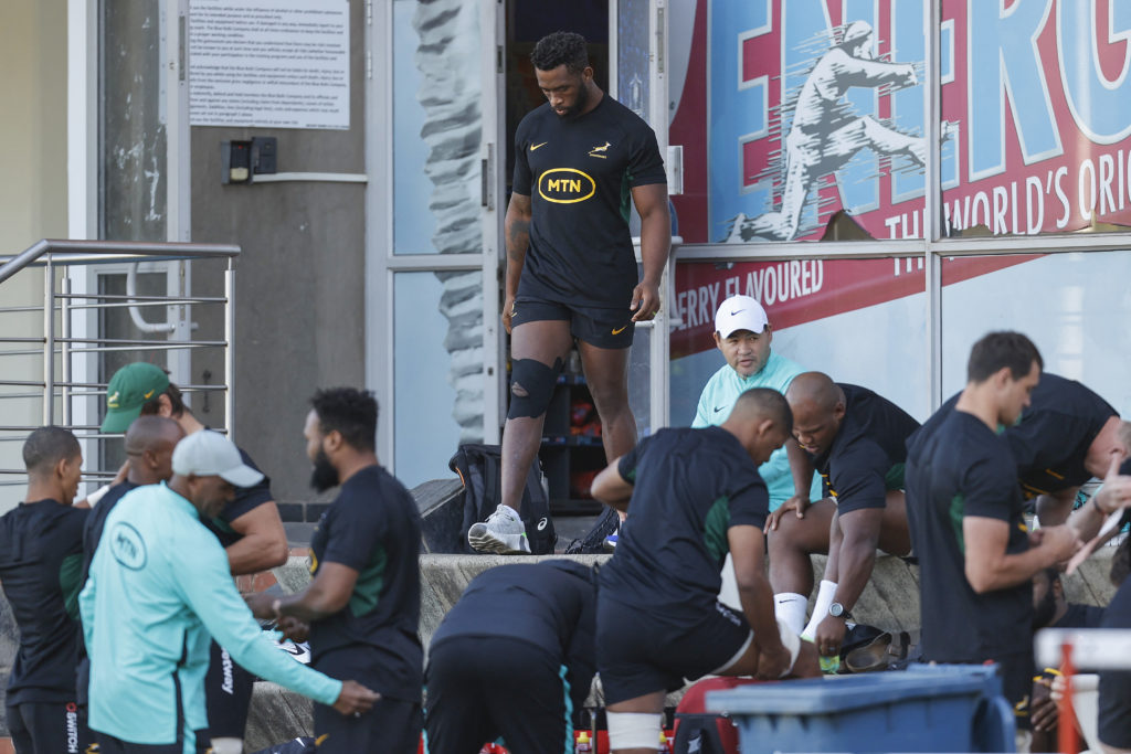 South African Springboks captain Siya Kolisi (C) walks with his right knee strapped during their team's training session at Loftus Versfeld Stadium in Pretoria on June 14, 2023 ahead of the upcoming Rugby Championship in July, 2023.