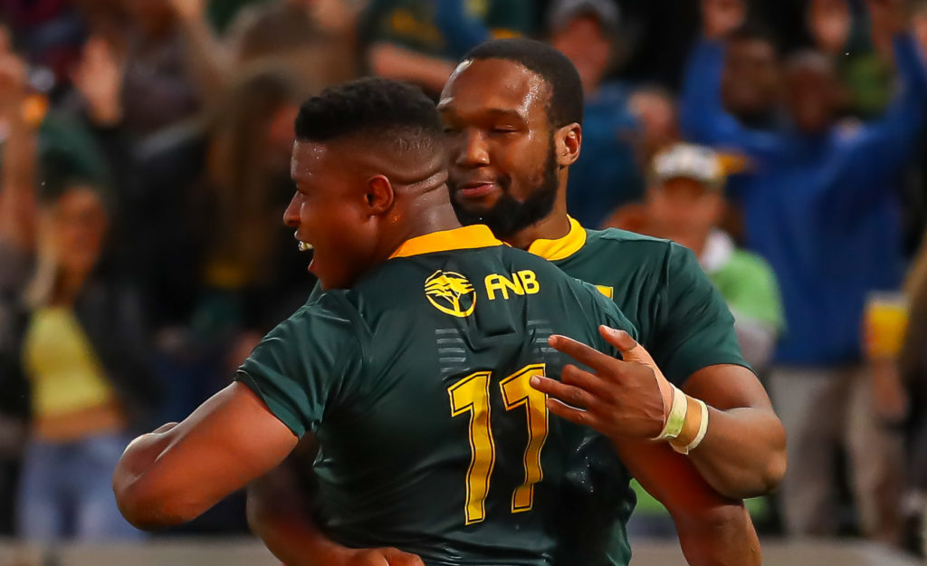 DURBAN, SOUTH AFRICA - AUGUST 18: Lukhanyo Am of South Africa congratulates Aphiwe Dyantyi of South Africa on scoring his try during the Rugby Championship match between South Africa and Argentina at Jonsson Kings Park on August 18, 2018 in Durban, South Africa.