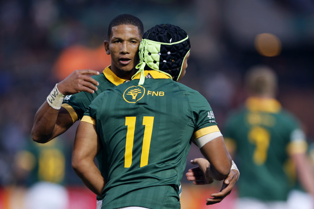 South Africa's wing Kurt-Lee Arendse (R) celebrates with South Africa's fly-half Manie Libbok (L) after scoring a try during the Rugby Championship first round match between South Africa and Australia at Loftus Versfeld stadium in Pretoria on July 8, 2023.