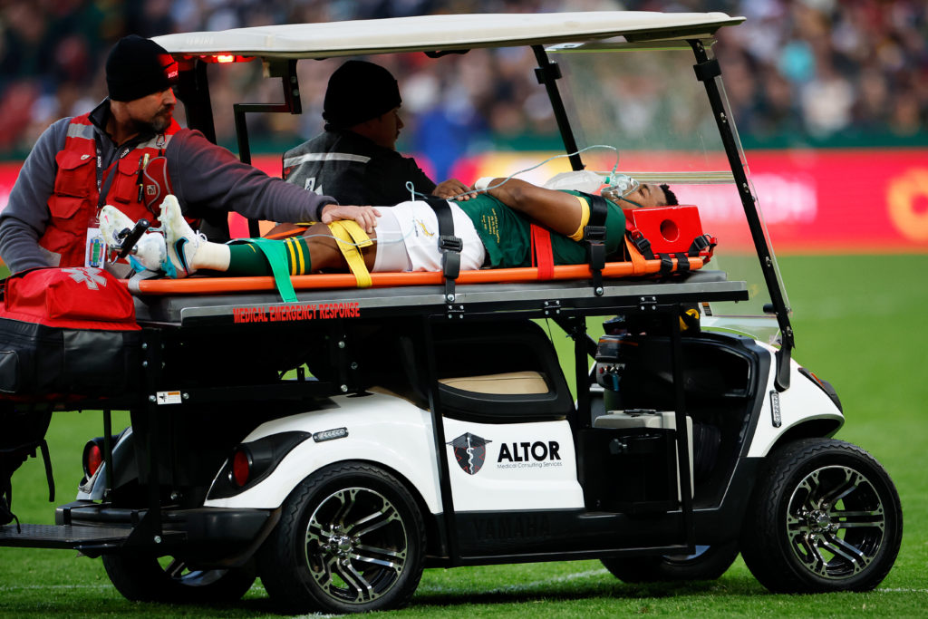 South Africa's scrumhalf Grant Williams (C) is evacuated by medical personnel on a stretcher placed on a vehicle after being injured during the Rugby Championship final-round match between South Africa and Argentina at Ellis Park in Johannesburg on July 29, 2023.