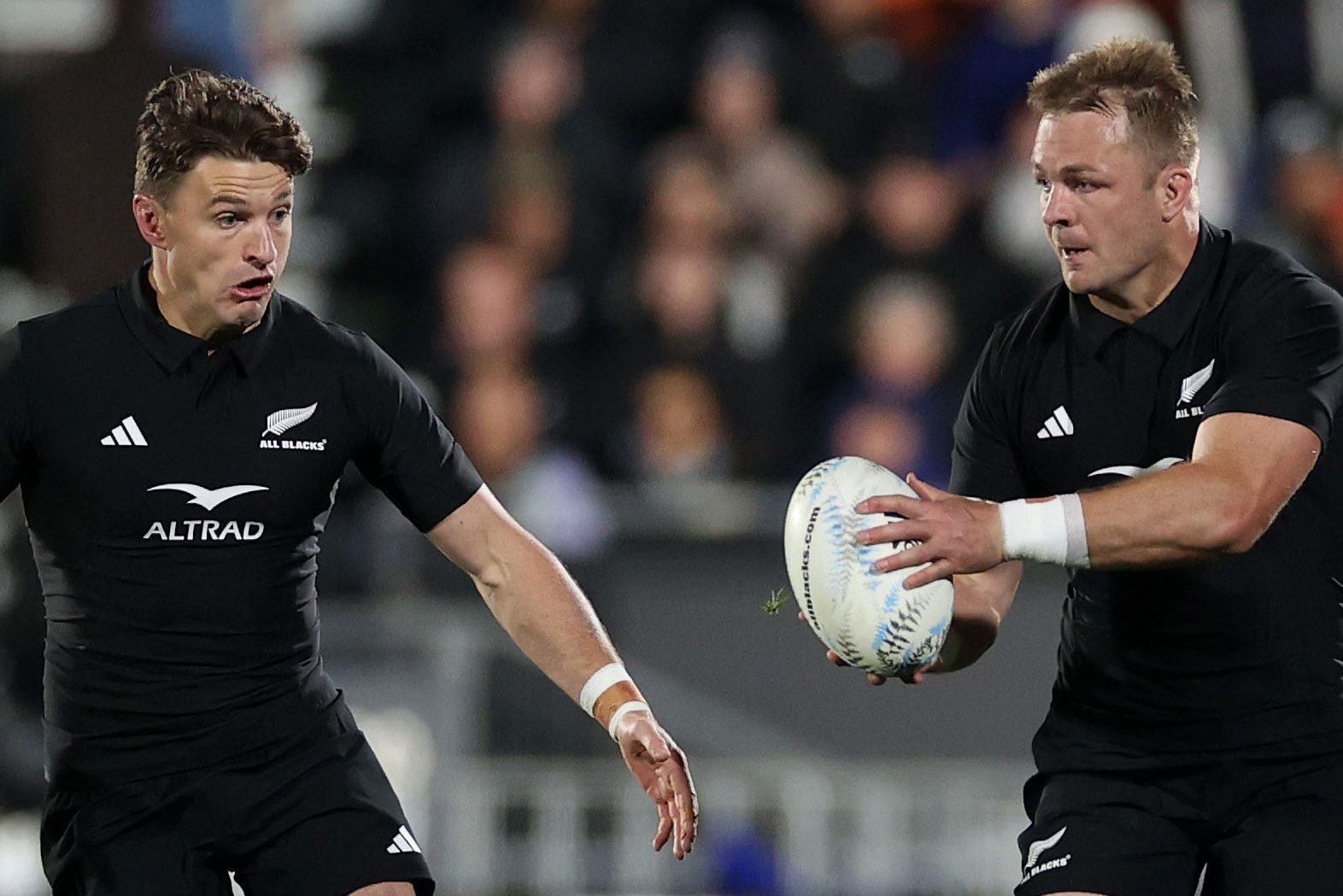 AUCKLAND, NEW ZEALAND - JULY 15: Sam Cane, captain of the All Blacks  (R) looks to pass to Beauden Barrett of the All Blacks    (L) during The Rugby Championship match between the New Zealand All Blacks and South Africa Springboks at Mt Smart Stadium on July 15, 2023 in Auckland, New Zealand. (Photo by Fiona Goodall/Getty Images)