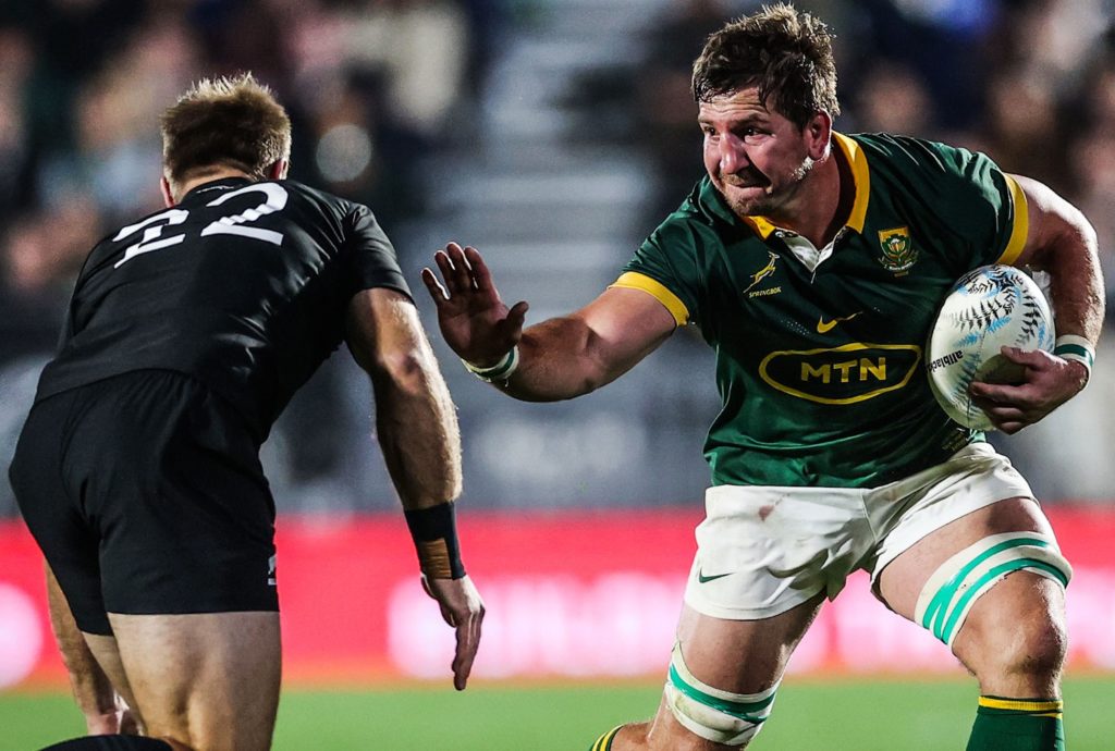 Kwagga Smith takes on Braydon Ennor of the All Blacks in Auckland