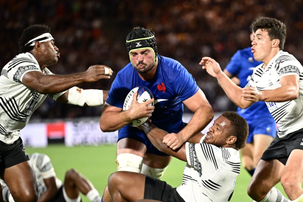 France's number eight Gregory Alldritt (C) is tackled by Fiji's fly-half Caleb Muntz (R) and Fiji's wing Vinaya Habosi (L) during the pre-World Cup friendly rugby union international match between France and Fiji at The Stade de la Beaujoire in Nantes, western France on August 19, 2023.