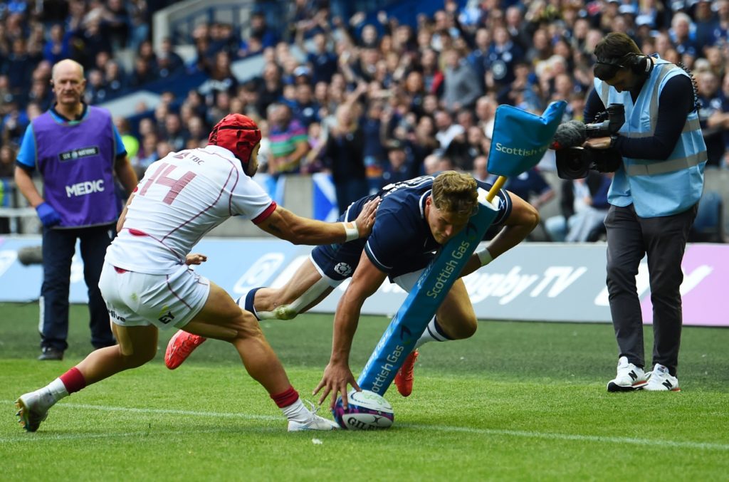 Scotland's wing Duhan van der Merwe (R) scores the final try during the pre-2023 World Cup warm-up rugby union match between Scotland and Georgia at Murrayfield Stadium in Edinburgh on August 26, 2023.