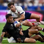 PARIS, FRANCE - SEPTEMBER 08: Rieko Ioane of New Zealand is tackled by Yoram Moefana and Damian Penaud of France during the Rugby World Cup France 2023 Pool A match between France and New Zealand at Stade de France on September 08, 2023 in Paris, France. (Photo by Mike Hewitt/Getty Images)