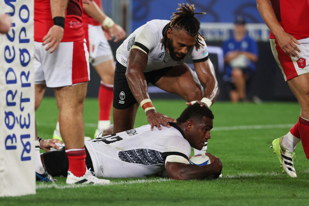 Fiji's wing Josua Tuisova (down) scores a try during the France 2023 Rugby World Cup Pool C match between Wales and Fiji at Stade de Bordeaux in Bordeaux, south-western France on September 10, 2023.