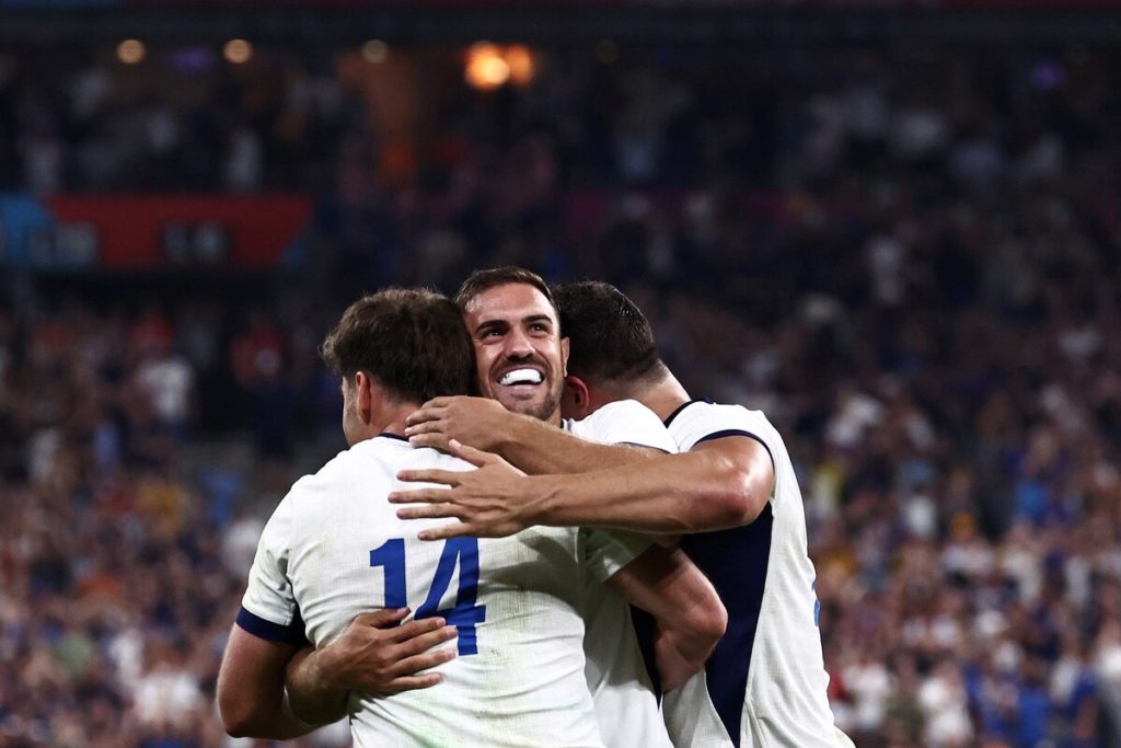 France's full-back Melvyn Jaminet (L) celebrates with teammates after scoring a try during the France 2023 Rugby World Cup Pool A match between France and New Zealand at Stade de France in Saint-Denis, on the outskirts of Paris on September 8, 2023.