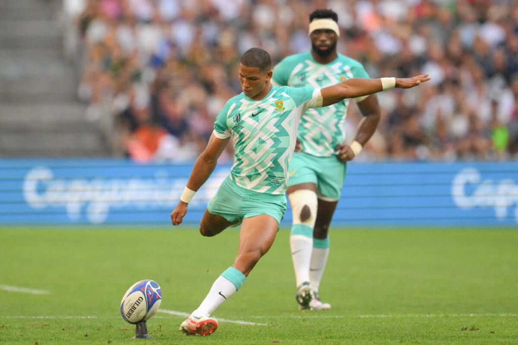 South Africa's flanker and captain Siya Kolisi (R) looks on as South Africa's fly-half Manie Libbok takes a penalty kick during the France 2023 Rugby World Cup Pool B match between South Africa and Scotland at Stade de Marseille in Marseille, southern France on September 10, 2023.