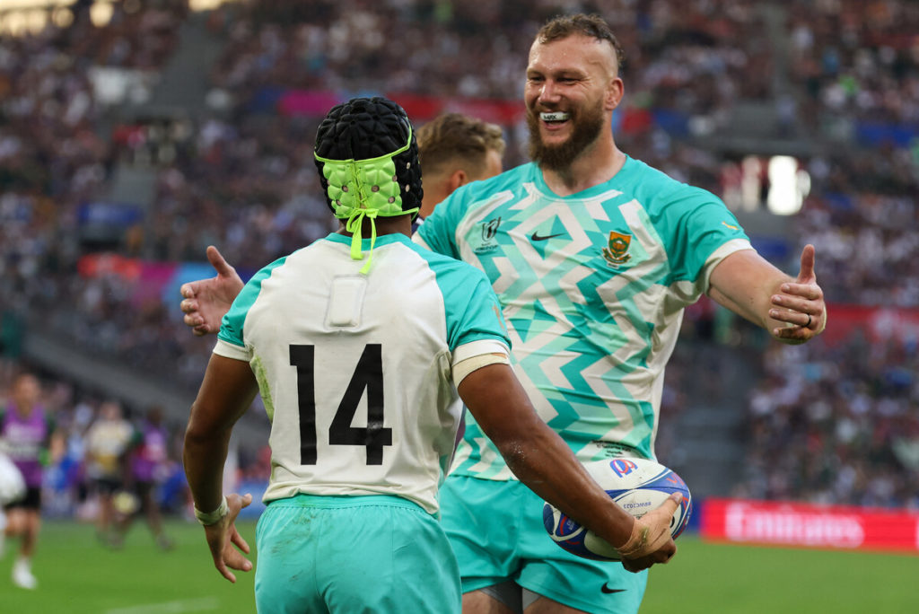 South Africa's wing Kurt-Lee Arendse (L) celebrates with South Africa's lock RG Snyman after scoring a try during the France 2023 Rugby World Cup Pool B match between South Africa and Scotland at Stade de Marseille in Marseille, southern France on September 10, 2023.