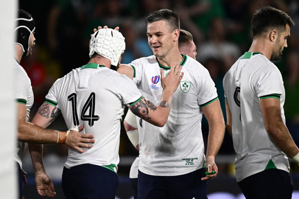 Ireland's wing Mack Hansen (2ndL) is congratulated by Ireland's fly-half Jonathan Sexton (C) after scoring a try during the 2023 Rugby World Cup Pool B match between Ireland and Tonga at the Stade de la Beaujoire in Nantes, western France on September 16, 2023.