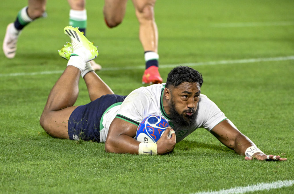 Ireland's centre Bundee Aki scores a try during the 2023 Rugby World Cup Pool B match between Ireland and Tonga at the Stade de la Beaujoire in Nantes, western France on September 16, 2023.