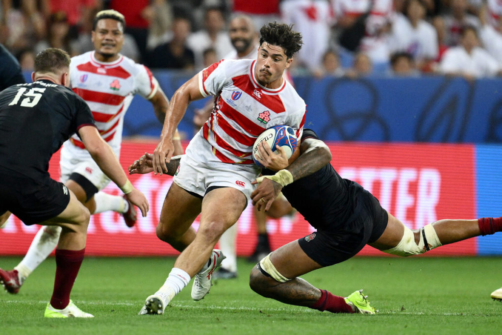 Japan's centre Dylan Riley breaks away during the France 2023 Rugby World Cup Pool D match between England and Japan at Stade de Nice in Nice, southern France on September 17, 2023.