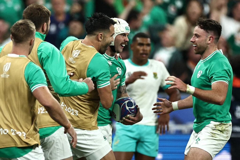 Ireland's right wing Mack Hansen (2nd L) celebrates with teammates after scoring a try during the France 2023 Rugby World Cup Pool B match between South Africa and Ireland at the Stade de France in Saint-Denis, on the outskirts of Paris, on September 23, 2023.