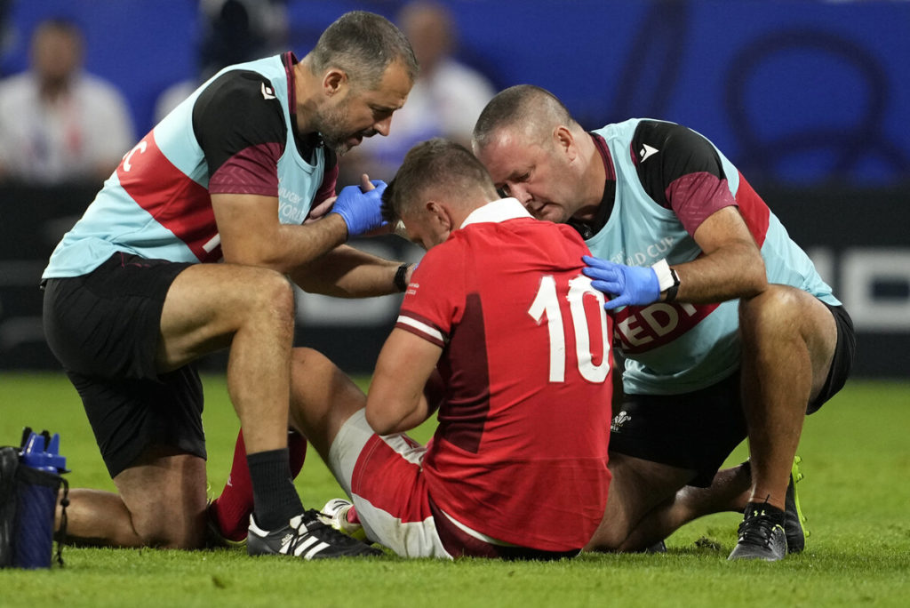 Wales' fly-half Dan Biggar receives medical assistance during the France 2023 Rugby World Cup Pool C match between Wales and Australia at the OL Stadium in Decines-Charpieu near Lyon, south-eastern France on September 24, 2023.