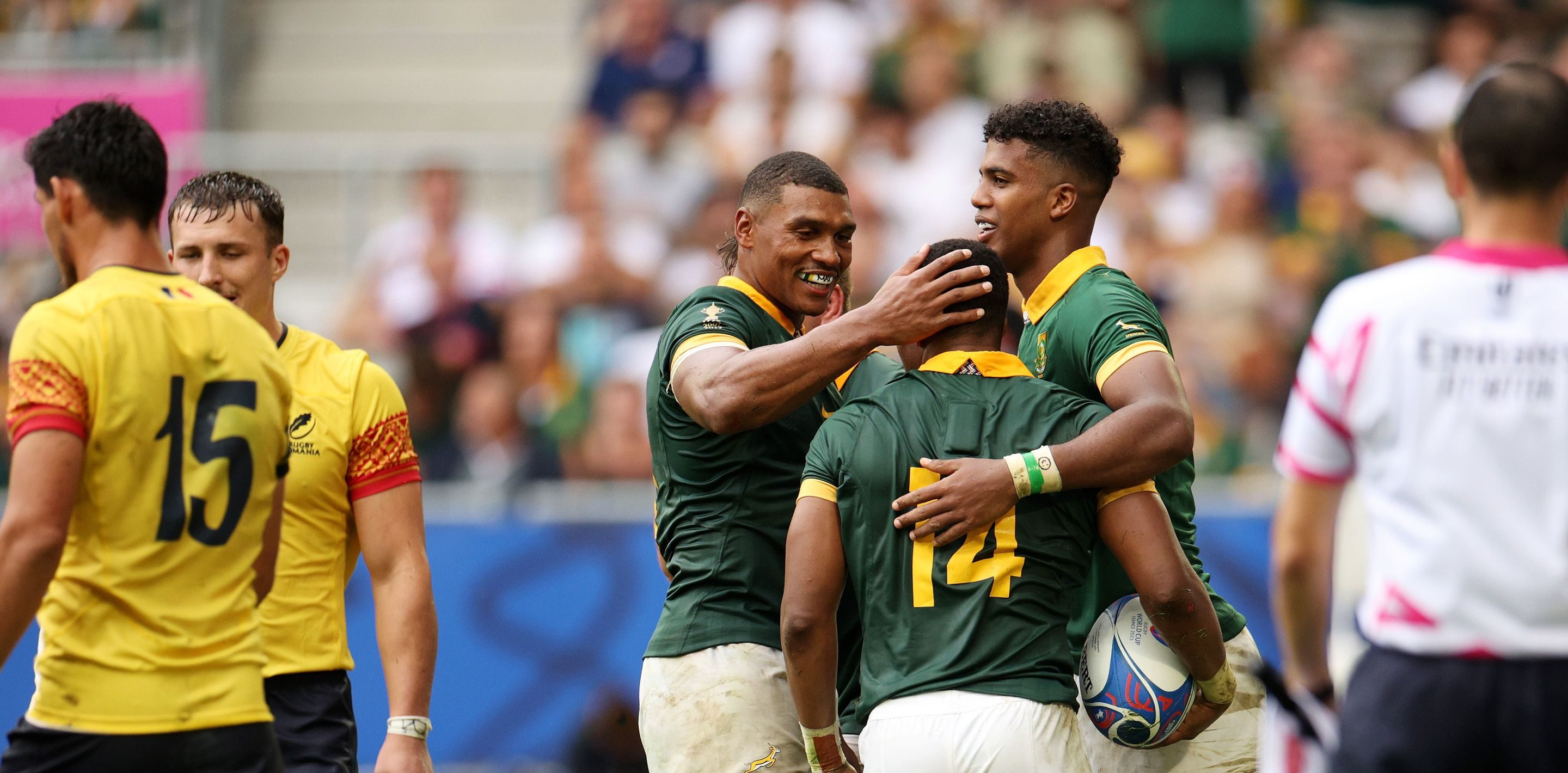 BORDEAUX, FRANCE - SEPTEMBER 17: Grant Williams of South Africa celebrates with Damian Willemse and Canan Moodie of South Africa after scoring his team's seventh try during the Rugby World Cup France 2023 match between South Africa and Romania at Nouveau Stade de Bordeaux on September 17, 2023 in Bordeaux, France. (Photo by Adam Pretty - World Rugby/World Rugby via Getty Images)