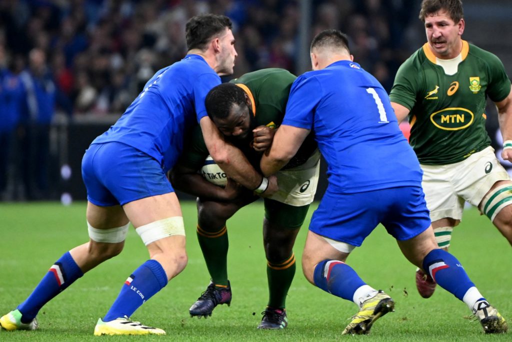 South Africa's prop Ox Nche (C) is challenged by France's flanker Charles Ollivon (L) and France's prop Cyril Baille (R) during the Autumn Nations Series rugby union test match between France and South Africa at the Velodrome stadium in Marseille on November 12, 2022.