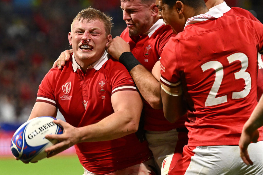 Wales' openside flanker and captain Jac Morgan celebrates after scoring a try during the France 2023 Rugby World Cup Pool C match between Wales and Australia at the OL Stadium in Decines-Charpieu near Lyon, south-eastern France on September 24, 2023.