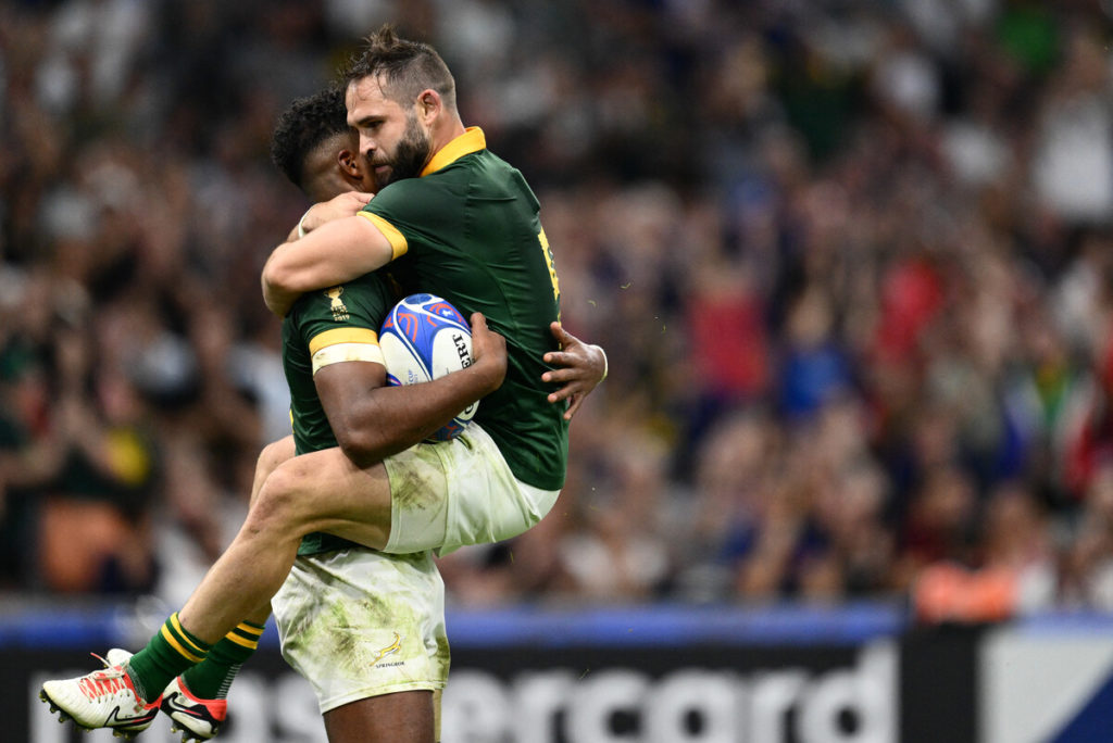 South Africa's centre Canan Moodie (l) celebrates with South Africa's scrum-half Cobus Reinach (R) after scoring a try during the France 2023 Rugby World Cup Pool B match between South Africa and Tonga at Stade Velodrome in Marseille, south-eastern France, on October 1, 2023.