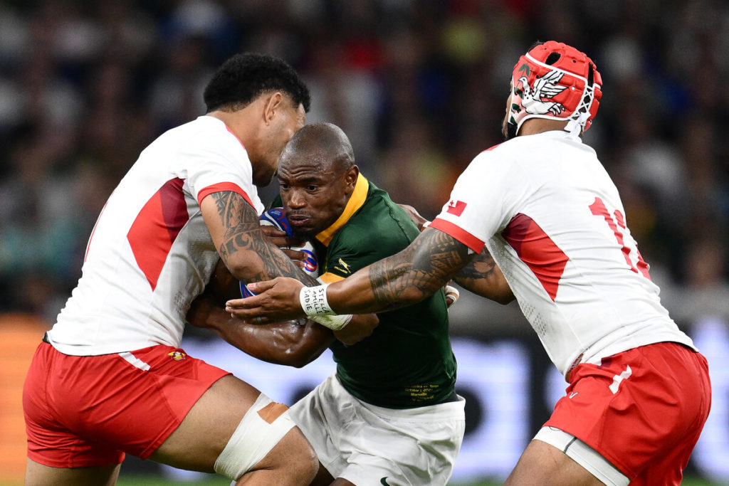 South Africa's wing Makazole Mapimpi fights for the ball during the France 2023 Rugby World Cup Pool B match between South Africa and Tonga at Stade Velodrome in Marseille, south-eastern France, on October 1, 2023.