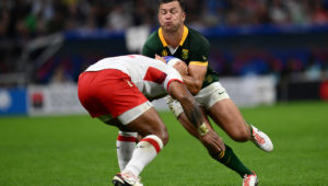 South Africa's fly-half Handre Pollard runs with the ball during the France 2023 Rugby World Cup Pool B match between South Africa and Tonga at Stade Velodrome in Marseille, south-eastern France, on October 1, 2023.