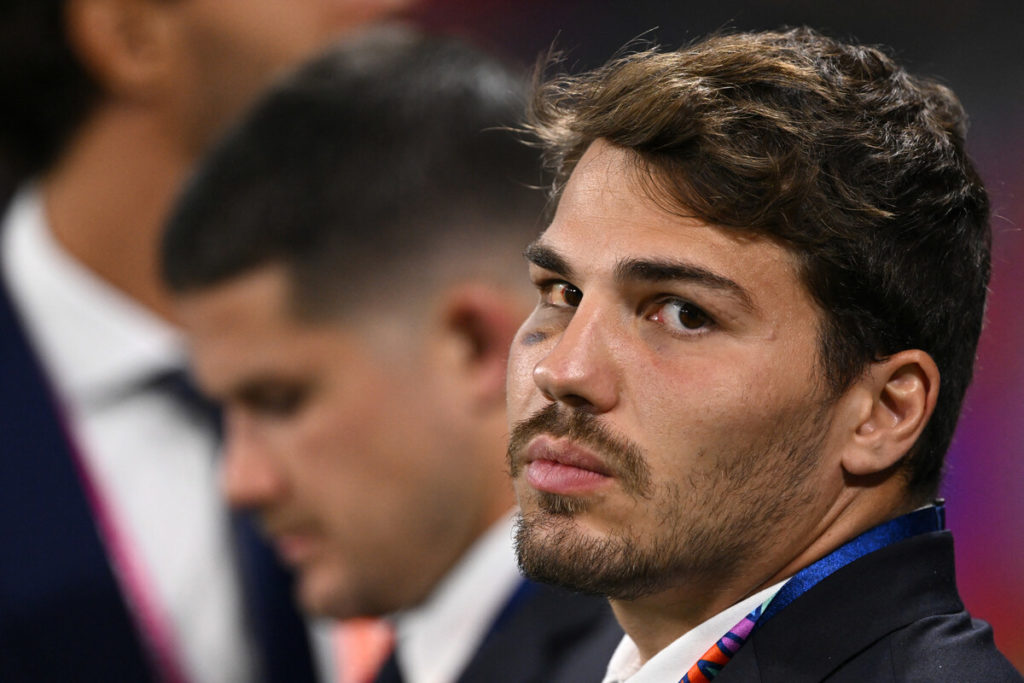 France's injured scrum-half Antoine Dupont watches on from the sidelines ahead of the France 2023 Rugby World Cup Pool A match between France and Italy at the OL Stadium in Lyon, south-eastern France on October 6, 2023.