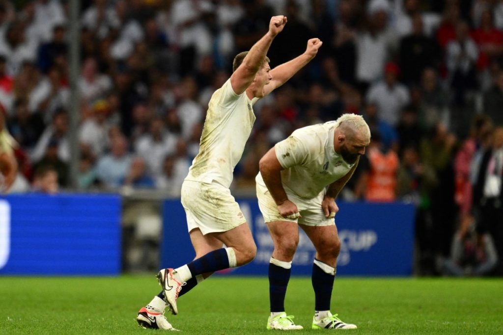 (From L) England's fly-half Owen Farrell and England's prop Joe Marler celebrate after winning the France 2023 Rugby World Cup quarter-final match between England and Fiji at the Velodrome Stadium in Marseille, southeastern France, on October 15, 2023.