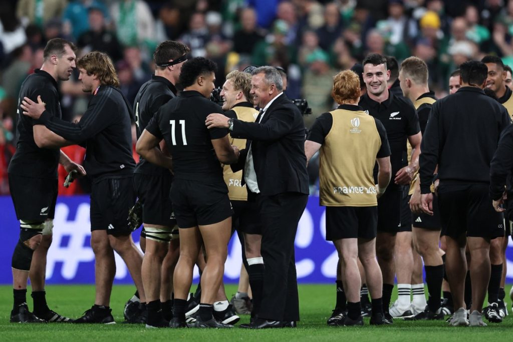 New Zealand's head coach Ian Foster (C) celebrates his team's victory with New Zealand's left wing Leicester Fainga'anuku (4th L) after the France 2023 Rugby World Cup quarter-final match between Ireland and New Zealand at the Stade de France in Saint-Denis, on the outskirts of Paris, on October 14, 2023.