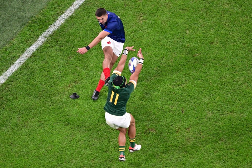 France's full-back Thomas Ramos (L) has his conversion attempt blocked by South Africa's wing Cheslin Kolbe during the France 2023 Rugby World Cup quarter-final match between France and South Africa at the Stade de France in Saint-Denis, on the outskirts of Paris, on October 15, 2023.