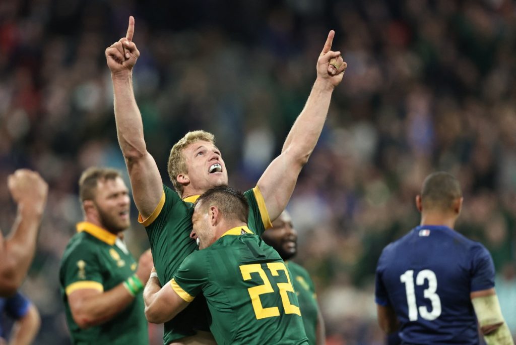 South Africa's flanker Pieter-Steph du Toit (C) and South Africa's fly-half Handre Pollard celebrate after victory during the France 2023 Rugby World Cup quarter-final match between France and South Africa at the Stade de France in Saint-Denis, on the outskirts of Paris, on October 15, 2023.