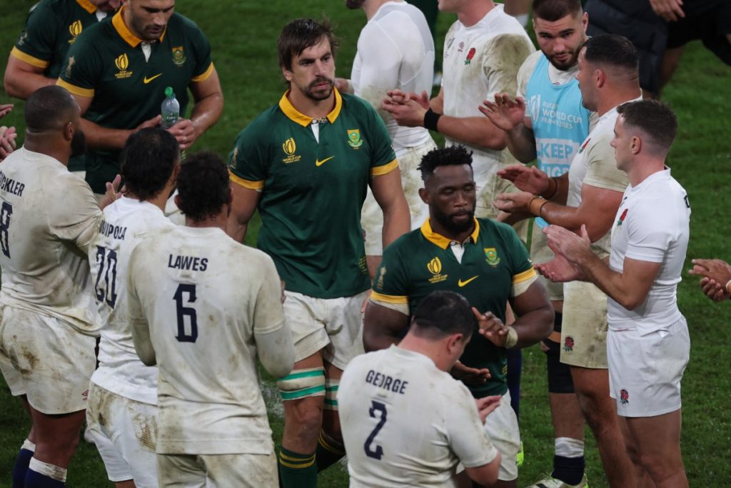 South Africa's lock Eben Etzebeth (CL) and South Africa's blindside flanker and captain Siya Kolisi (CR) walk through a guard of honour at the end of the France 2023 Rugby World Cup semi-final match between England and South Africa at the Stade de France in Saint-Denis, on the outskirts of Paris, on October 21, 2023.